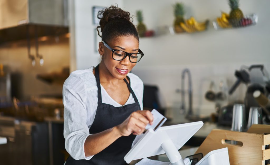 create an invoice template, business woman swiping card on a machine