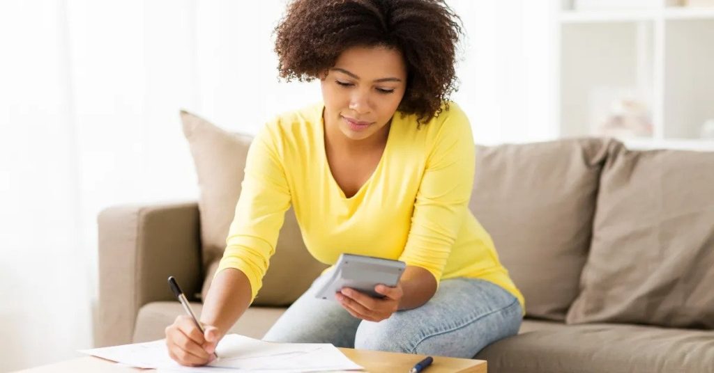 online invoicing tools, woman making notes on a document