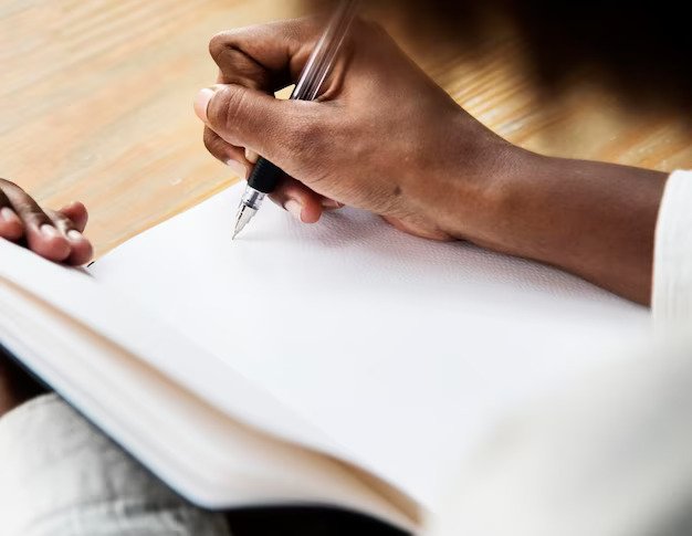 handwritten invoice, business owner writing on a notebook