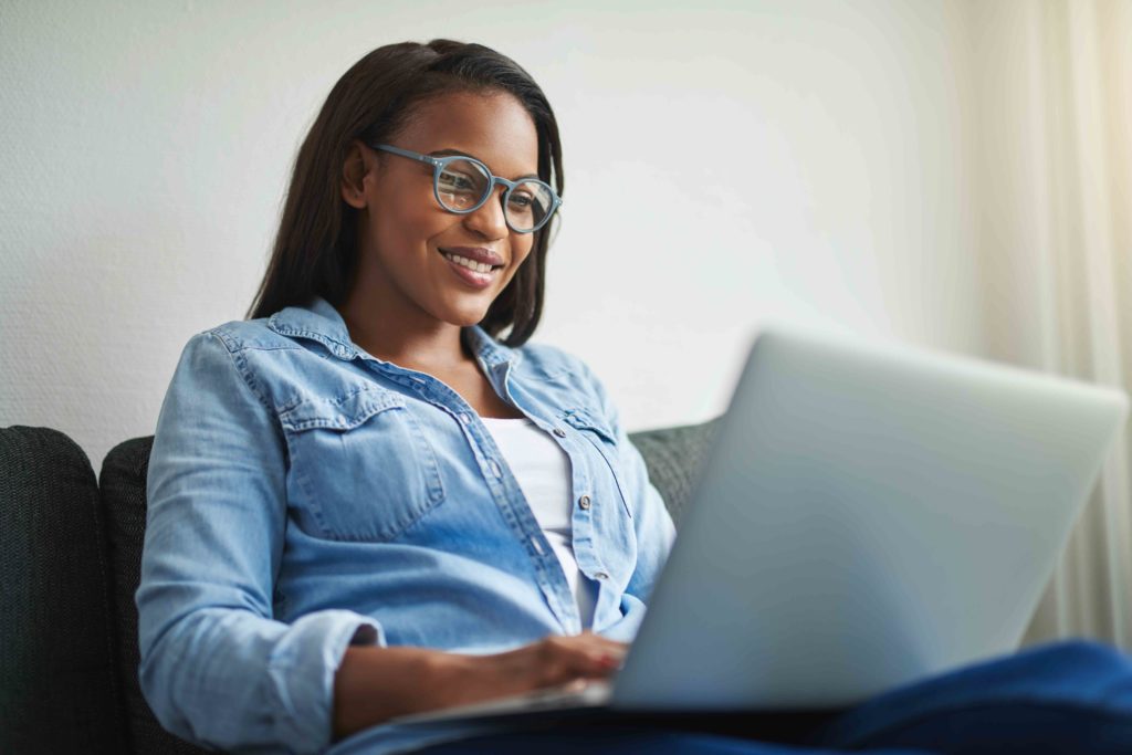 woman on her pc smiling, could easily pass for someone who wants to Start An Online Store